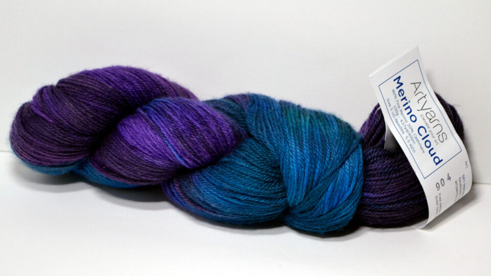 Blue and Purple skein of Artyarns Merino Cloud yarn in Berry Bliss.